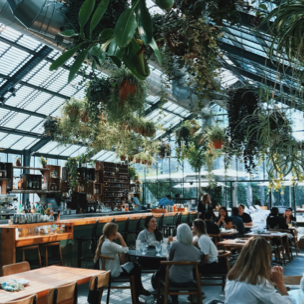  a dinning area and bar housed in a green house